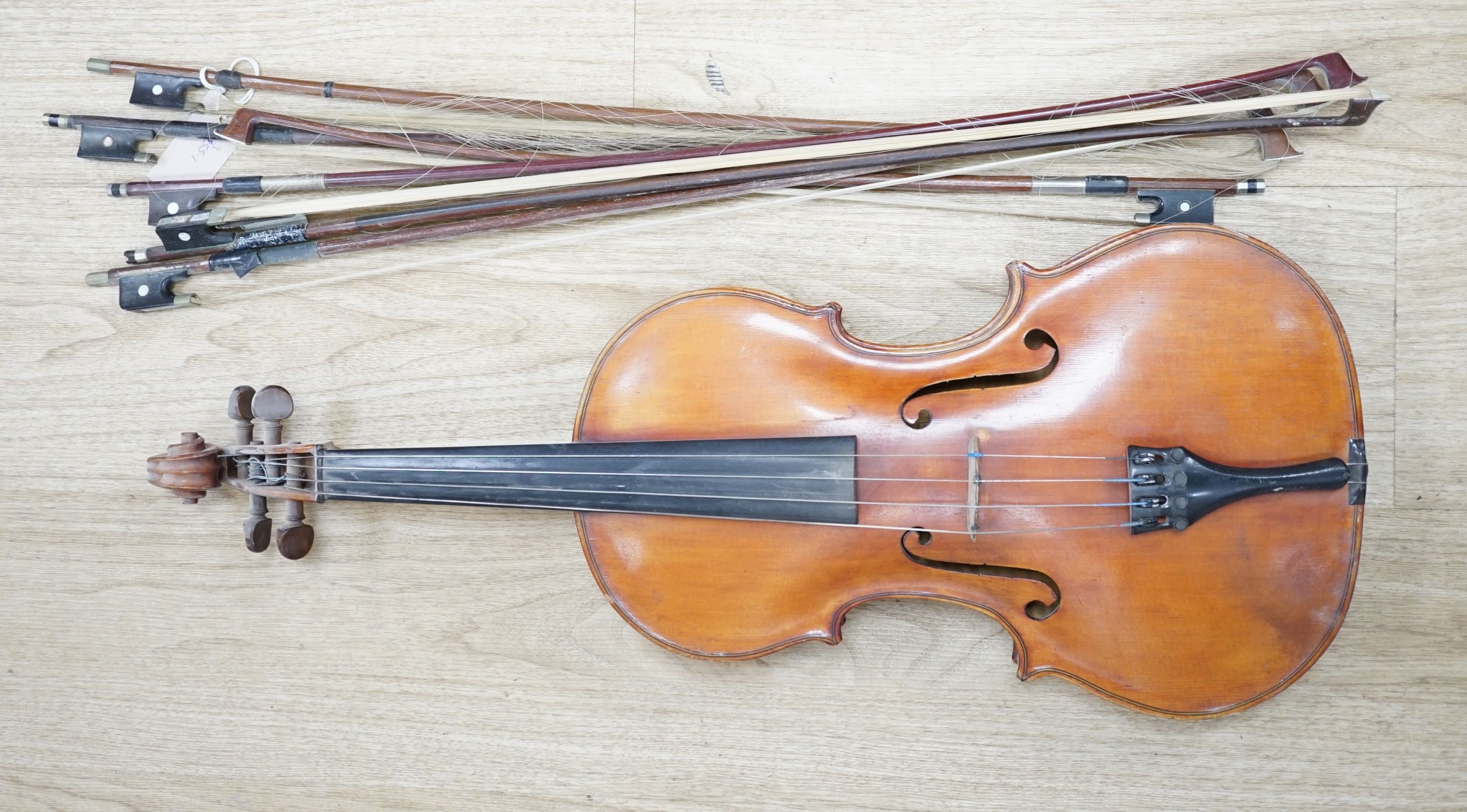 A Viola, assorted bows and a violin back
